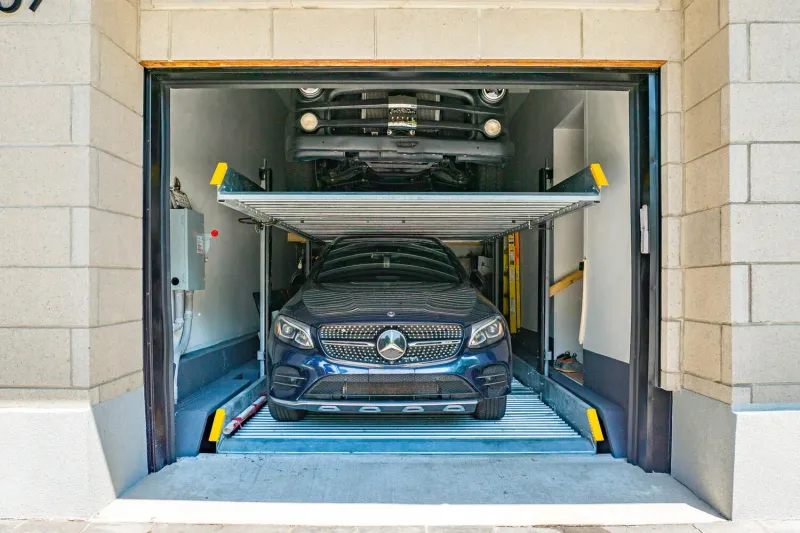 Riverview three-car garage with a car lift