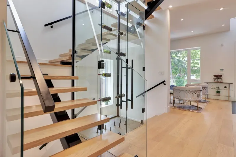 Riverview floating staircase and glass wine closet