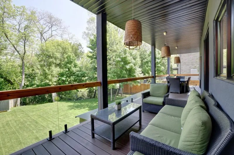 Covered Riverview patio overlooking the backyard